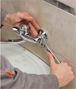 Plumber Repairing Bathroom